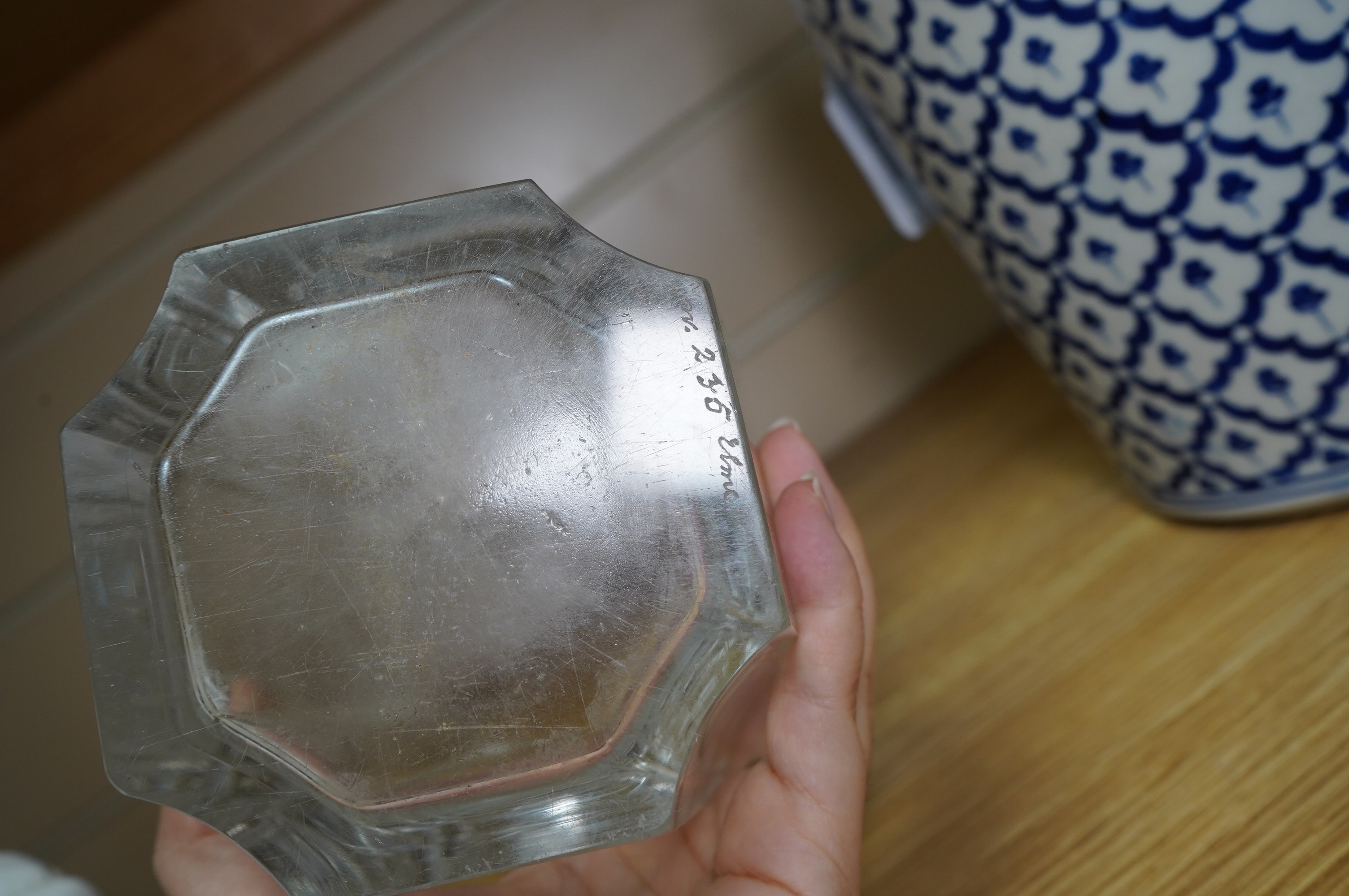 Emil Weidlich for Elme, a 1930s Swedish cut and etched glass vase decorated with a figure tipping a floral cornucopia. Condition - minute chips to two corner tips of the rim otherwise very good, The glass engraver Weidli